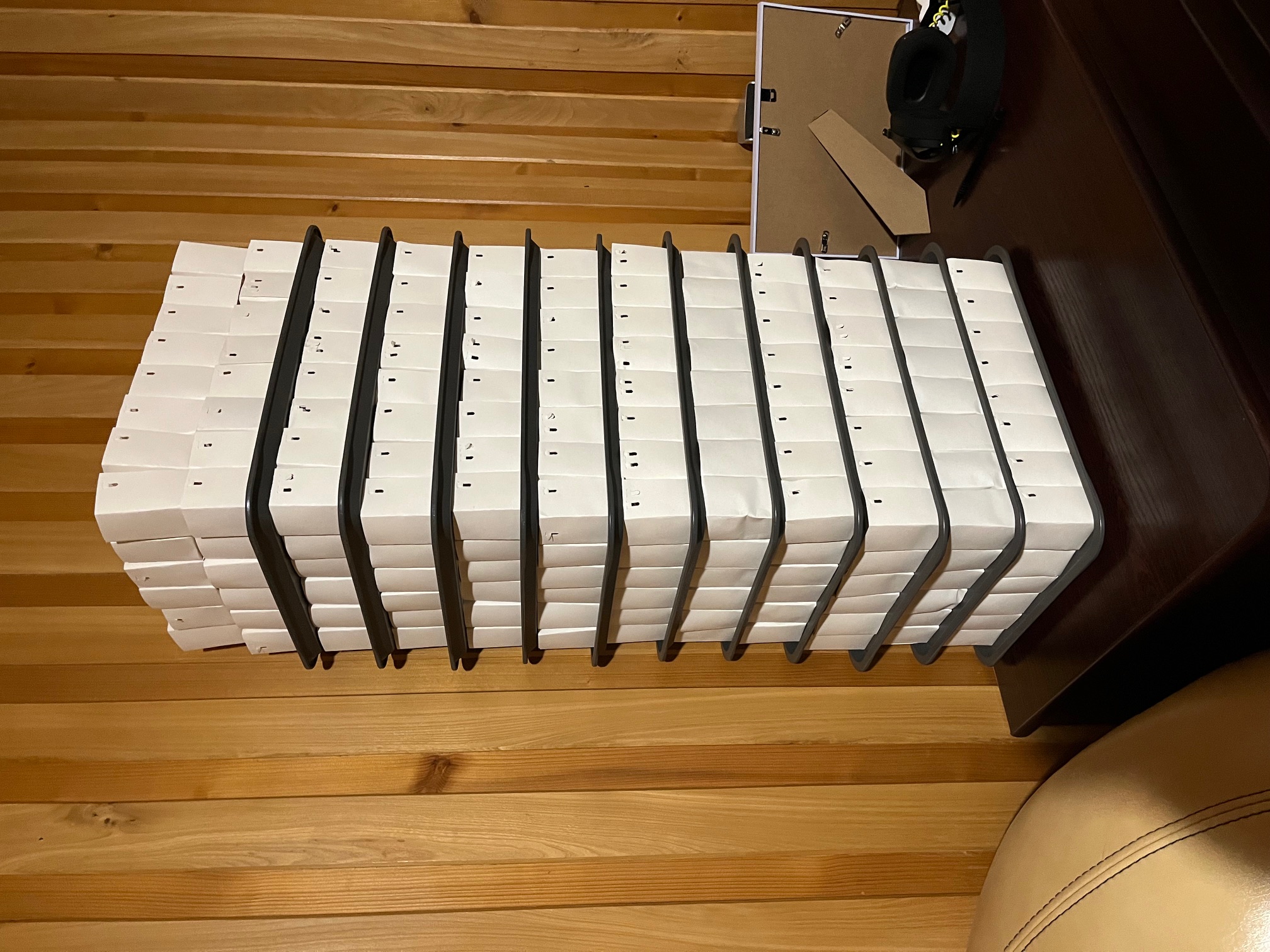 Multiple stacks of origami paper boxes that act as planting pots.